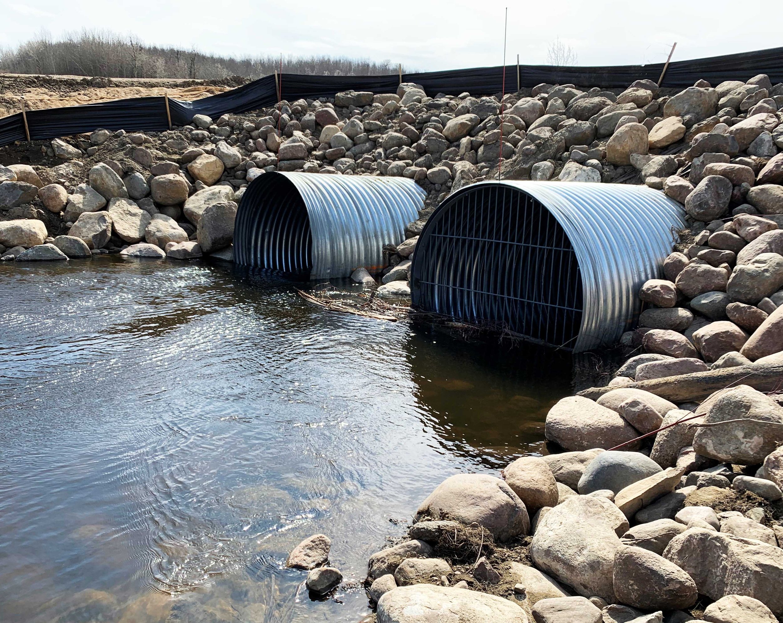 Twin culverts set in rip-rap